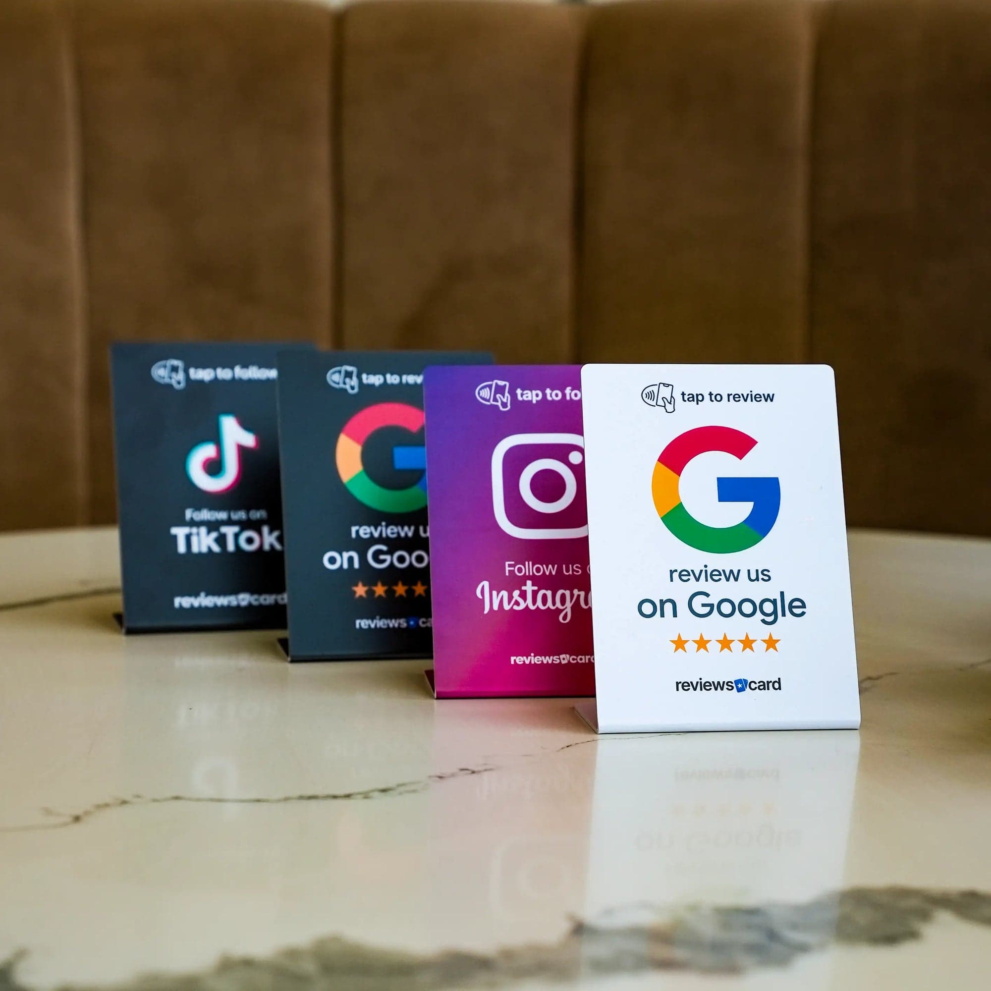 ReviewsCard NFC stands on a counter — Google, Instagram, TikTok and more